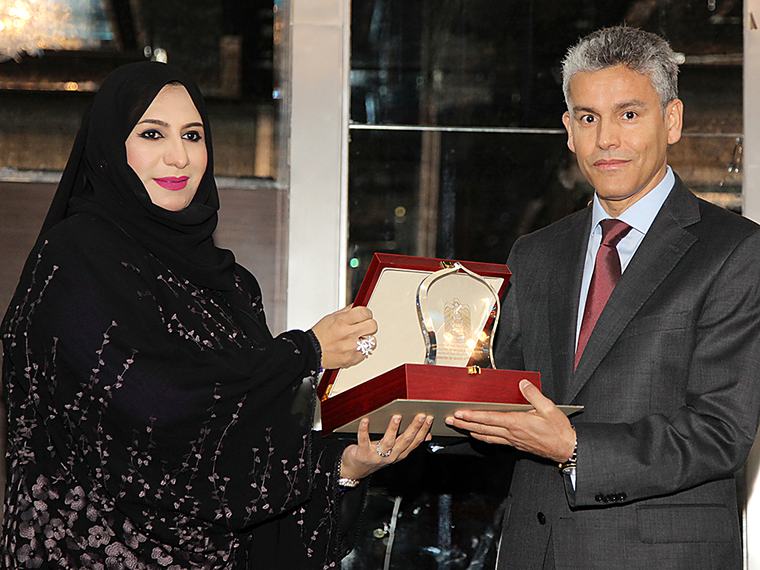 Receiving a recognition award at a conference